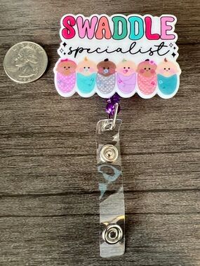 Swaddle Specialist badge reel